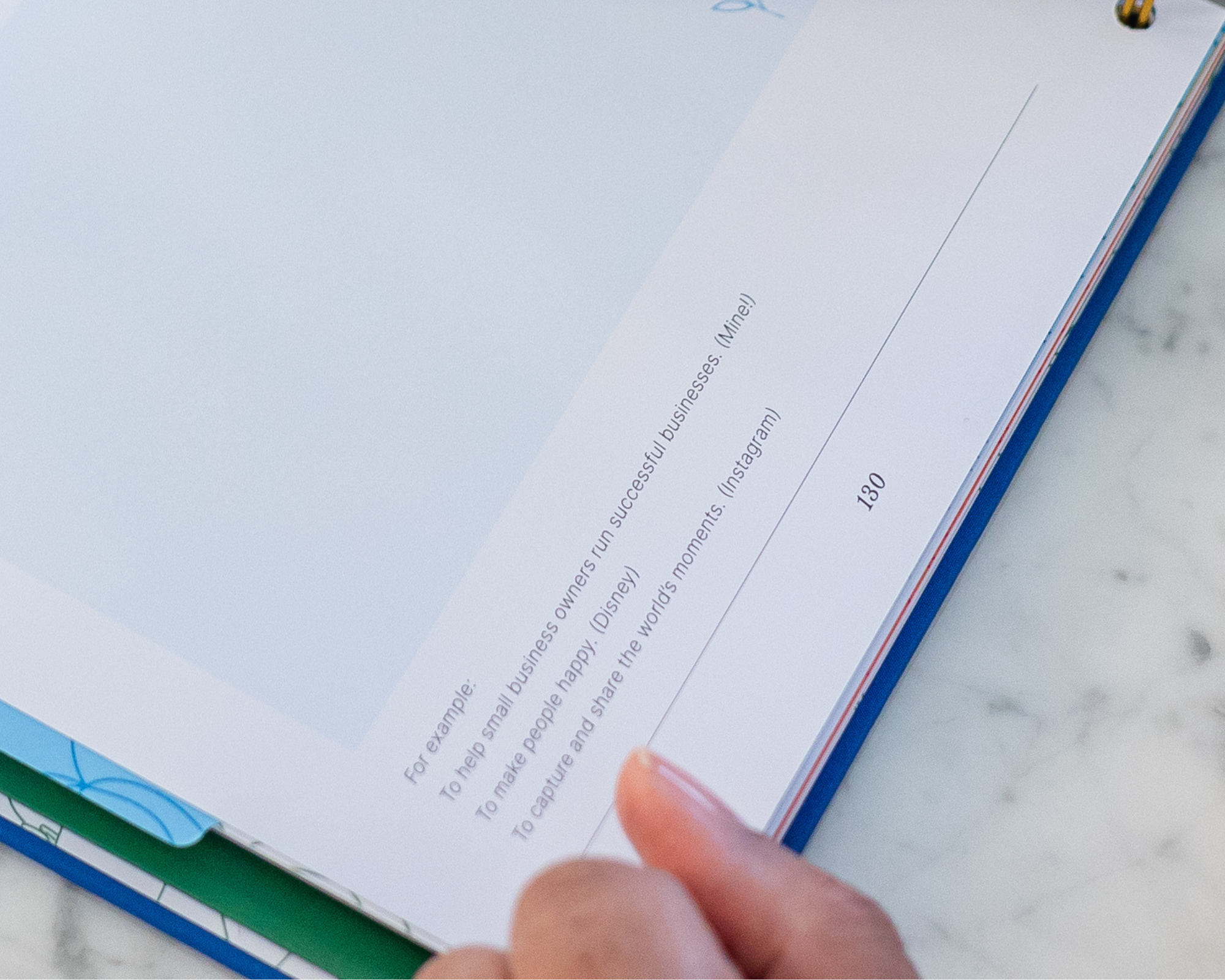 Image of the tabs of each section of The Guided Small Business Planner. Brightly colored tabs for all 11 sections.